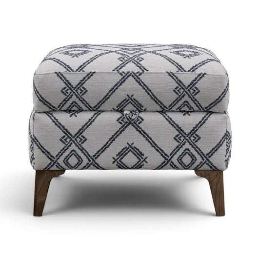 Pieces For Places high leg storage stool in grey fabric with a navy blue geometric diamond pattern and wooden feet.