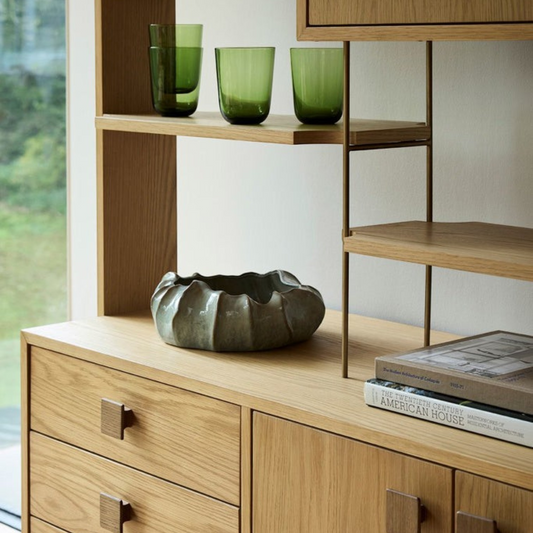Pieces For Places larsen Room Divider in light oak wood with open shelving, drawers, and minimalist square handles.