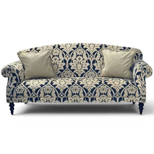 Pieces For Places Tallis Midi Sofa in navy and cream damask chenille fabric with two neutral cushions and dark wood legs.