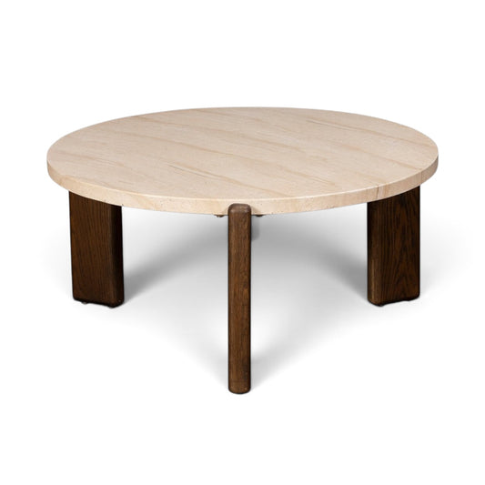 Pieces For Places Ida round coffee table with a beige travertine finish concrete top and solid oak legs.