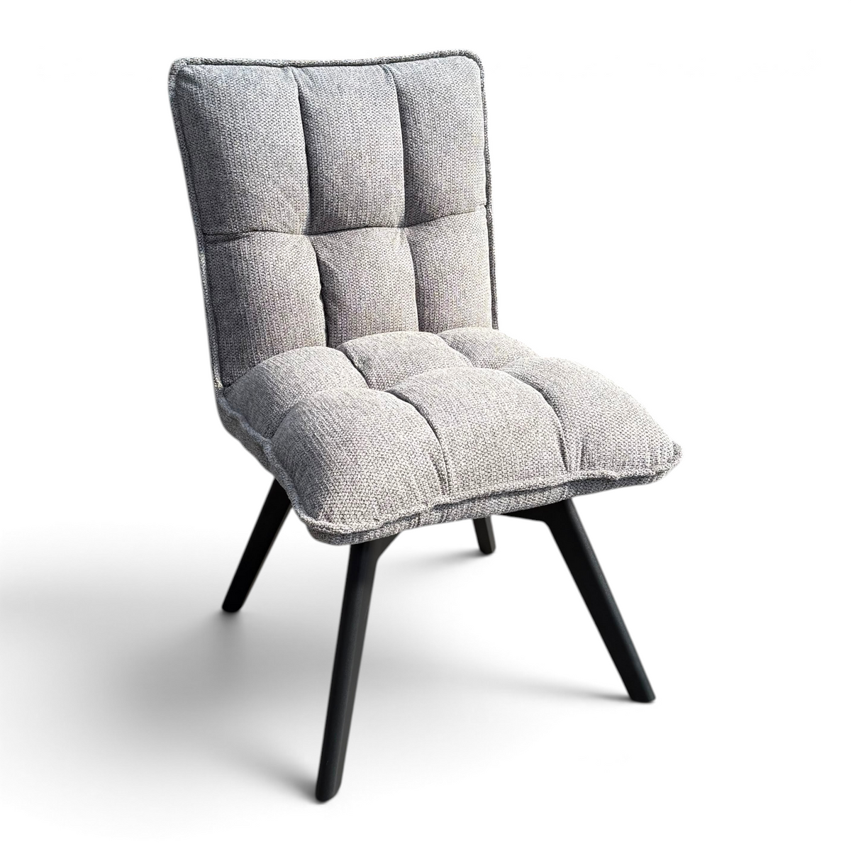 Pieces For Places Bubble grey fabric swivel dining chair with a tufted cushioned seat and black metal legs.