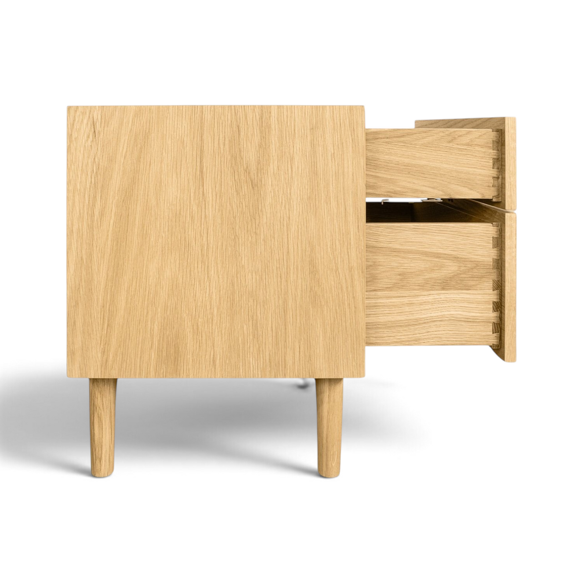 Pieces For Places Larsen 2 drawer bedside table in natural oak wood with tapered legs and dovetail drawer joints.