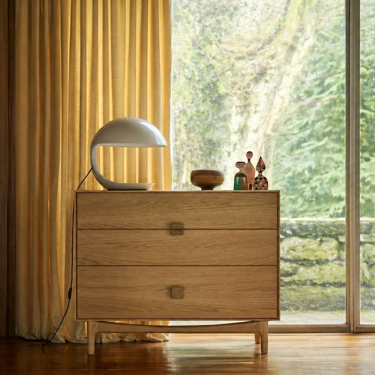 Pieces For Places Larsen 3 drawer chest in light oak wood with a modern Danish design, styled with a table lamp.
