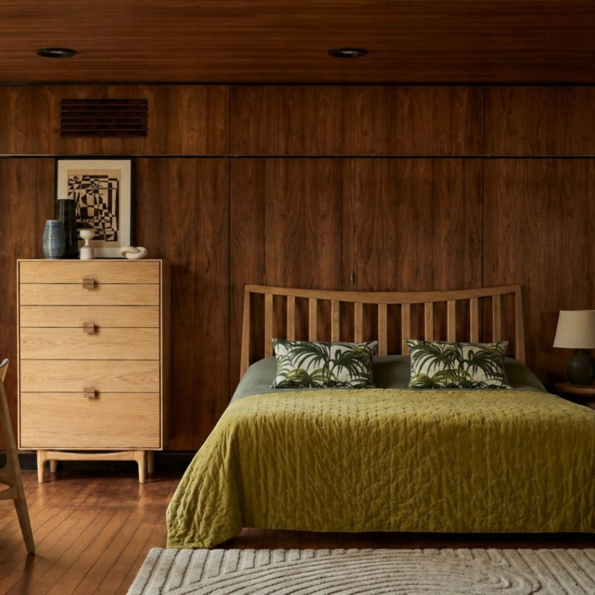Pieces For Places Larsen 6 drawer tall chest in light oak wood, positioned in a mid-century modern bedroom setting.