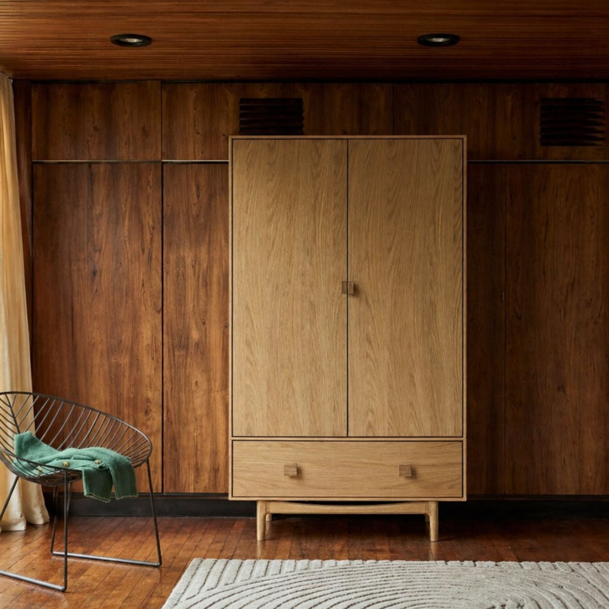 Pieces For Places Larsen double wardrobe in natural oak with mid-century design, tapered legs, and a lower drawer.