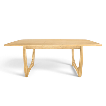 Pieces For Places Larsen extending dining table in natural wood with mid-century Scandinavian curved leg design.