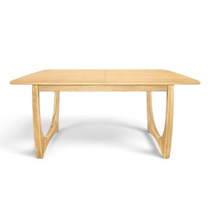 Pieces For Places Larsen extending dining table in natural wood with a mid-century Scandinavian curved leg design.