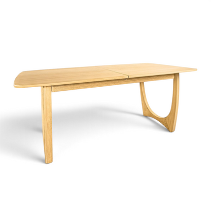Pieces For Places Larsen extending dining table in light oak with a mid-century Scandinavian curved leg design.