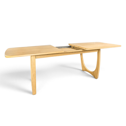 Pieces For Places Larsen extending dining table in natural wood with mid-century Scandinavian design and curved legs.