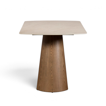 Pieces For Places Lusso 135cm dining table with a beige sintered stone top and a conical ash wood veneer pedestal base.