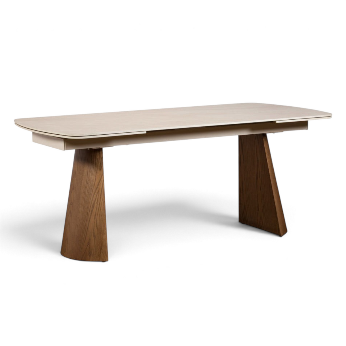 Pieces For Places extending dining table with a cream sintered stone top and curved ash-veneered wooden legs.