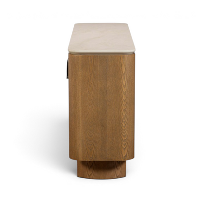 Pieces For Places Lusso wide sideboard with a light sintered stone top and curved ash wood veneer frame, side view.