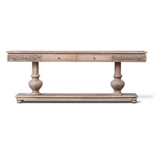 Pieces For Places Oyster reclaimed elm hall table featuring intricate carved drawer fronts and two pedestal bases.