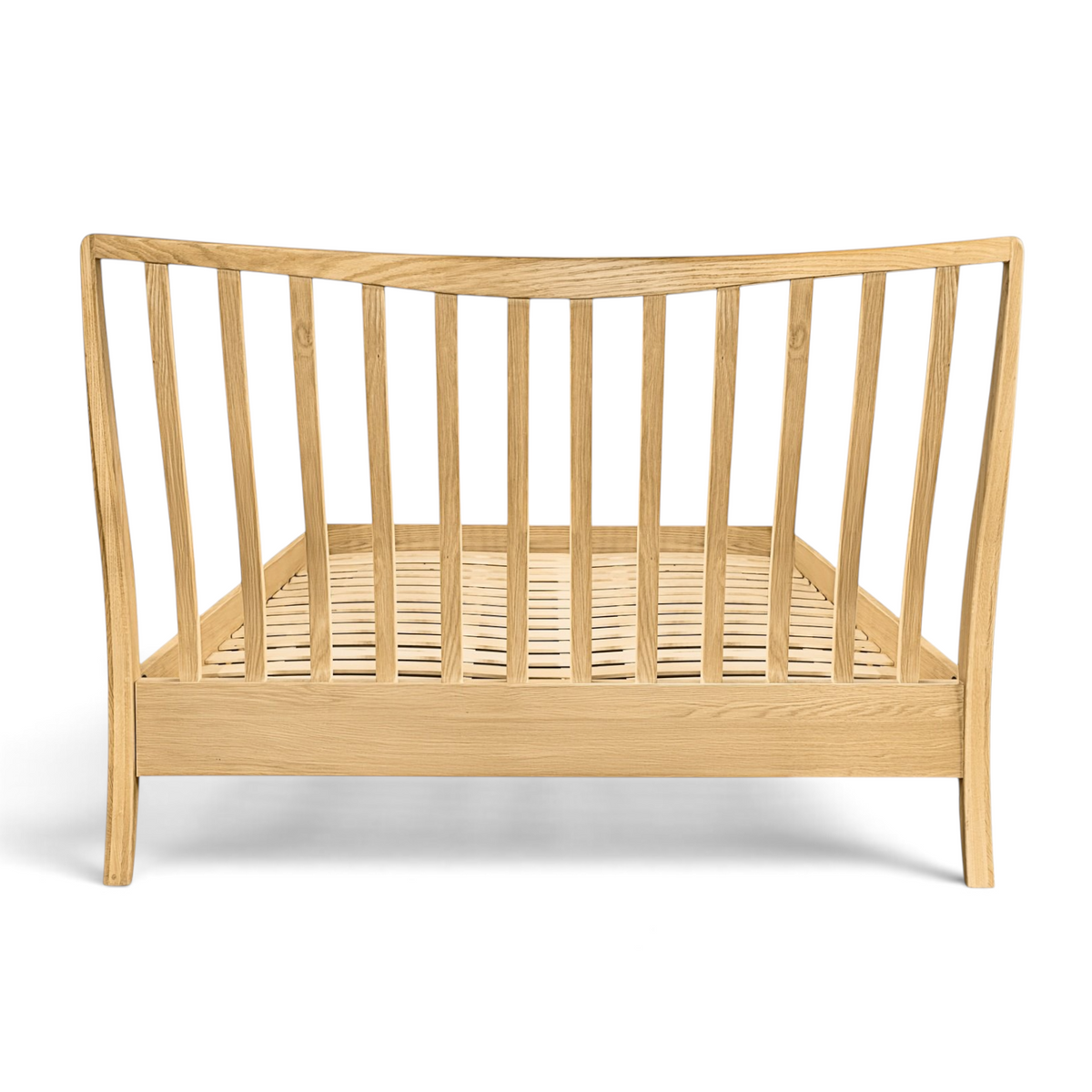 Pieces For Places Larsen oak bed frame with a spindle headboard design and natural wood grain finish.