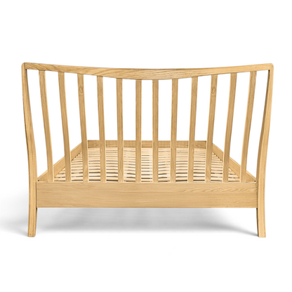 Pieces For Places Larsen oak bed frame with a spindle headboard design and natural wood grain finish.