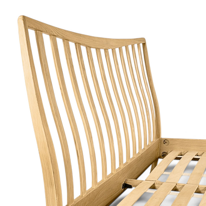 Pieces For Places Larsen oak bed frame featuring a curved spindle headboard and wooden slatted base