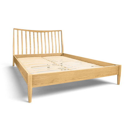 Pieces For Places Larsen oak bed frame with a spindle headboard and light wood finish in a modern Danish style.