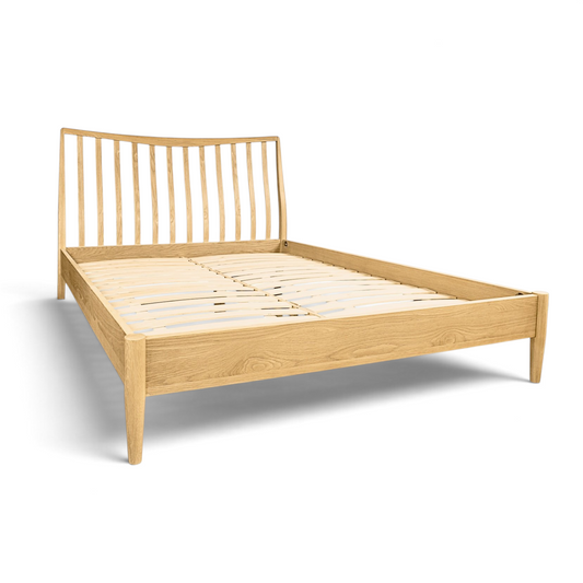 Pieces For Places Larsen oak bed frame with a spindle headboard and light wood finish in a modern Danish style.
