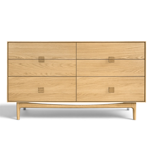 Pieces For Places Larsen 6 drawer wide chest in light oak wood with a minimalist Danish design and tapered legs.