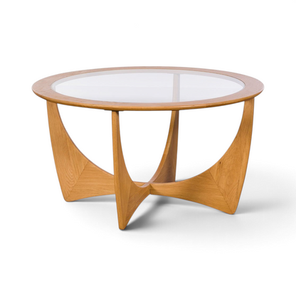 Pieces For Places Larsen round coffee table with a clear glass top and sculptural light oak wood base