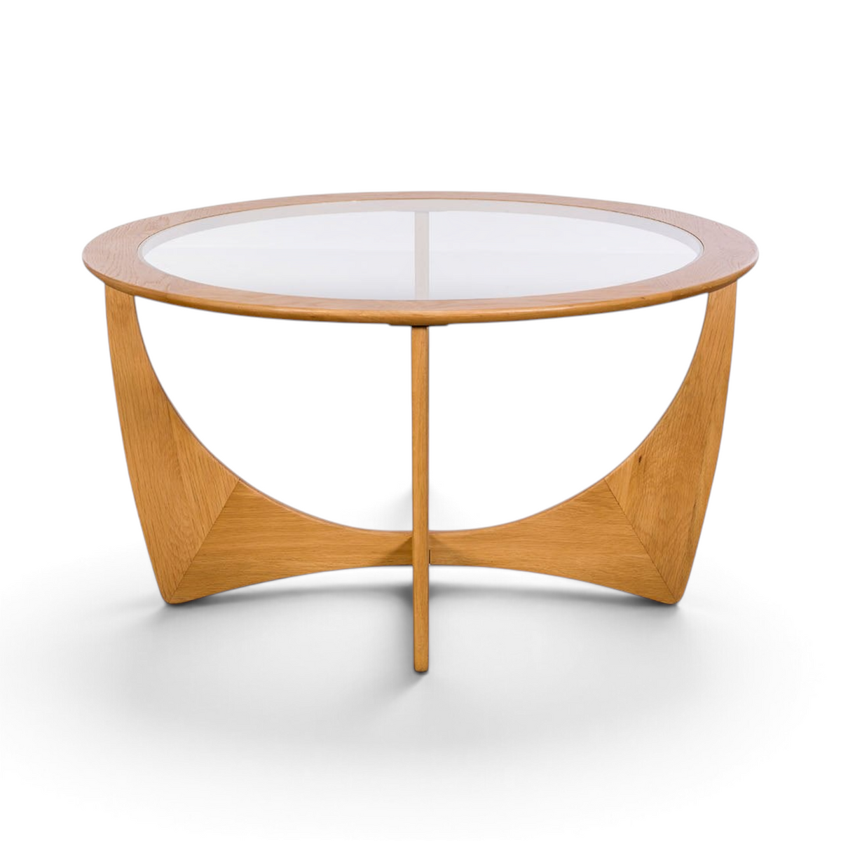 Pieces For Places Larsen round coffee table with a glass top and sculptural light oak wood base in mid-century style.