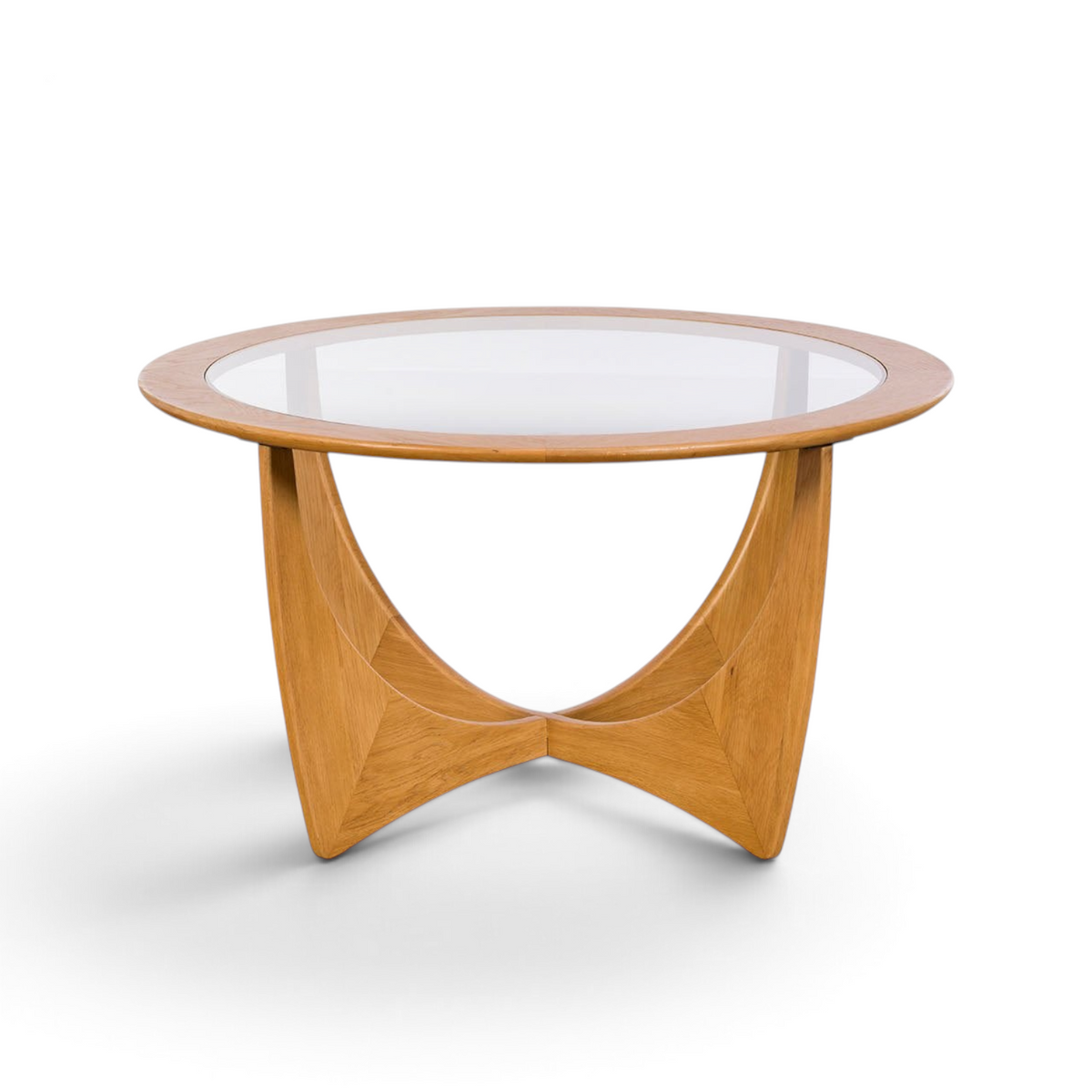 Pieces For Places Larsen round coffee table with a glass top and sculptural light wood base in mid-century style.