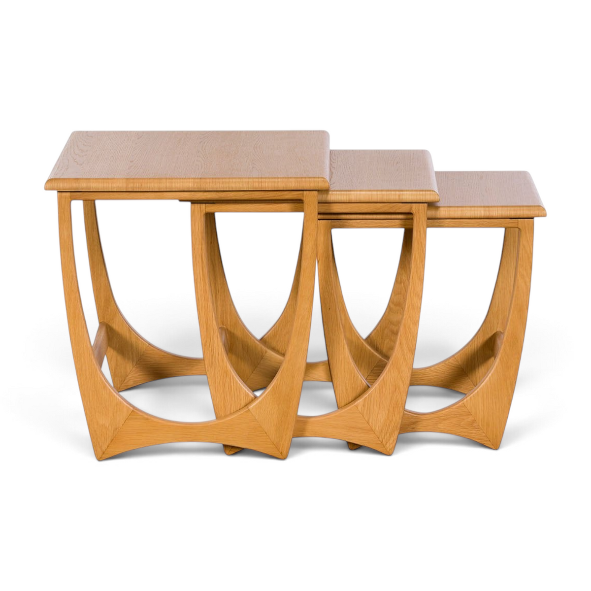 Pieces For Places Larsen nest of three wooden tables featuring a Danish-inspired curved frame design in light oak.