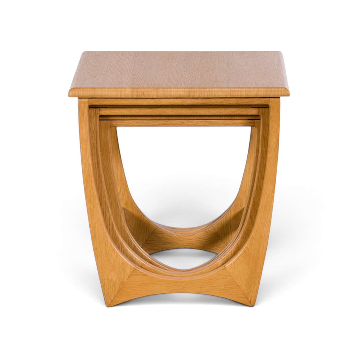 Pieces For Places Larsen nest of three tables in light oak wood with a curved Danish-inspired design.