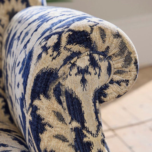 Pieces For Places Tallis Grand Sofa upholstered in blue and natural ikat chenille fabric with rolled arms.