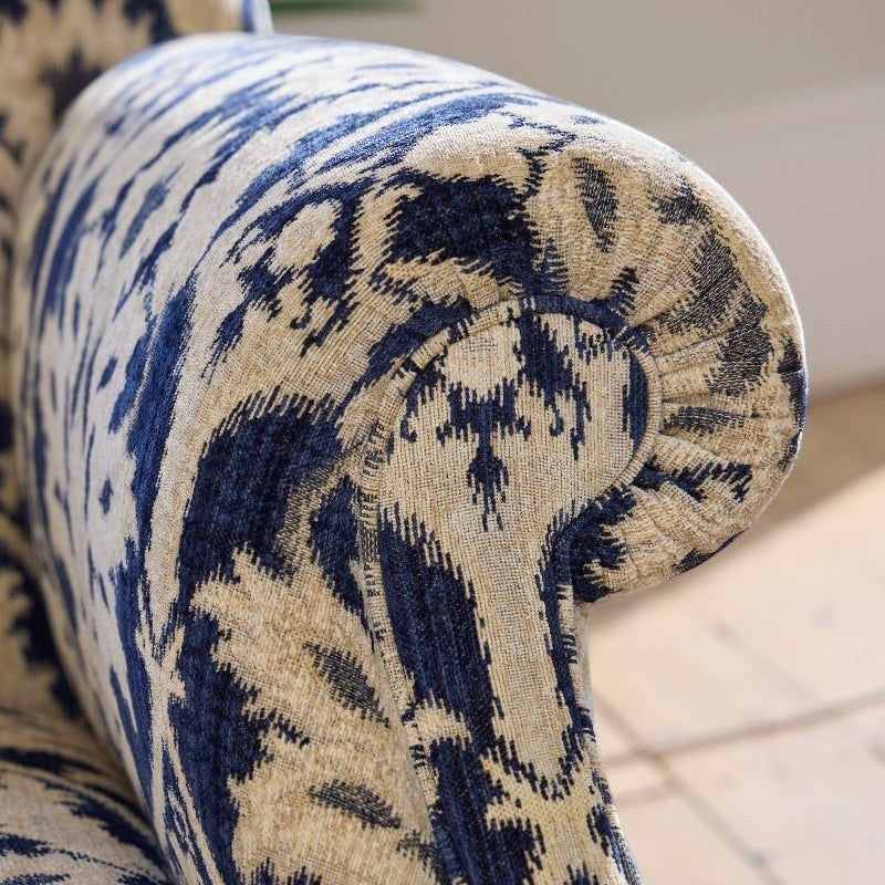 Pieces For Places Tallis Grand Sofa upholstered in blue and natural ikat chenille fabric with rolled arms.