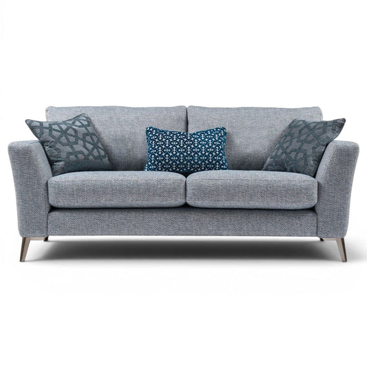 Pieces For Places Florence 2.5 Seater Sofa in grey textured fabric with reversible seat cushions and decorative blue scatter cushions.