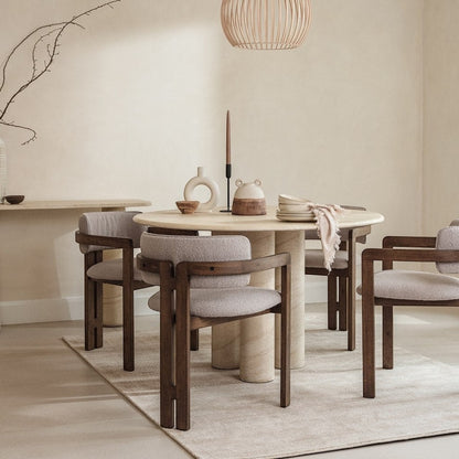 Pieces For Places Ida 120cm round dining table with travertine finish and column base in a neutral modern dining room.