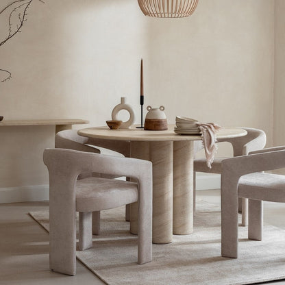 Pieces For Places Ida 120cm round dining table with a travertine finish and column base in a neutral dining room