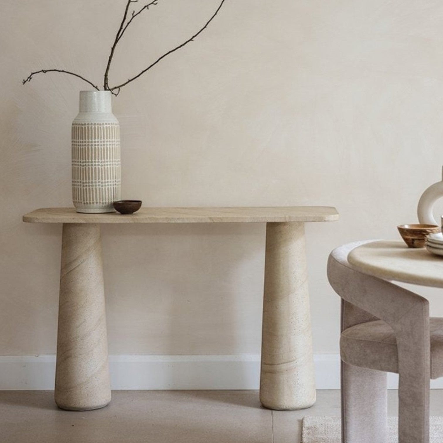 Pieces For Places Ida console table with travertine finish, concrete top, and two sturdy column legs in a neutral room