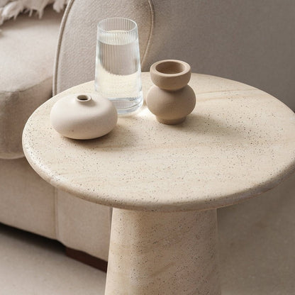 Pieces For Places Ida round lamp table in a beige travertine finish with a sleek central column leg
