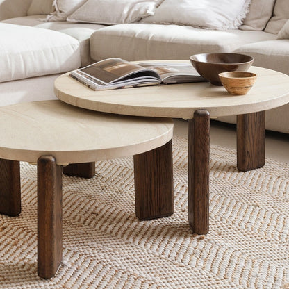 Pieces For Places Ida small round nesting coffee table with travertine finish top and solid oak legs in living room