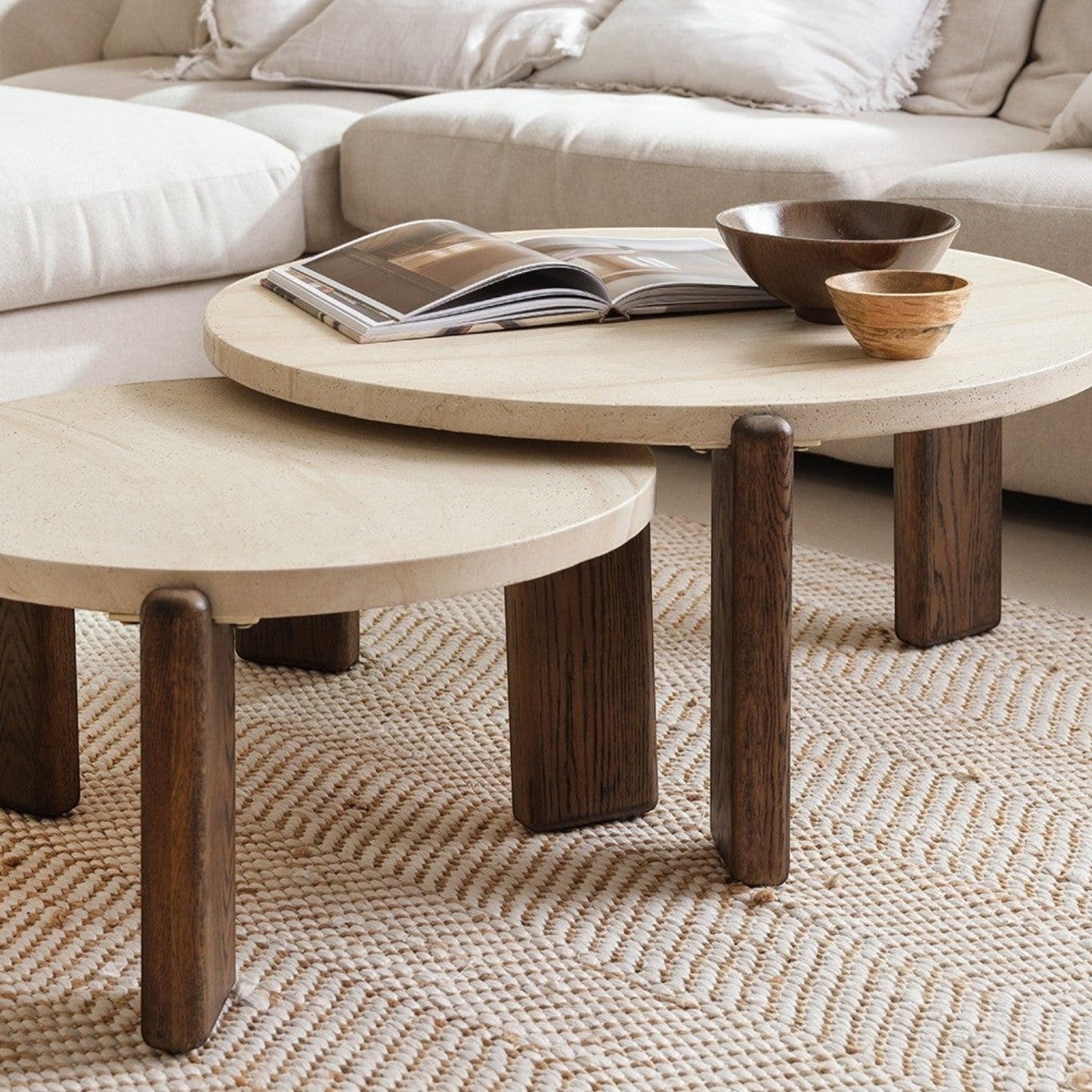 Pieces For Places Ida small round nesting coffee table with travertine finish top and solid oak legs in living room