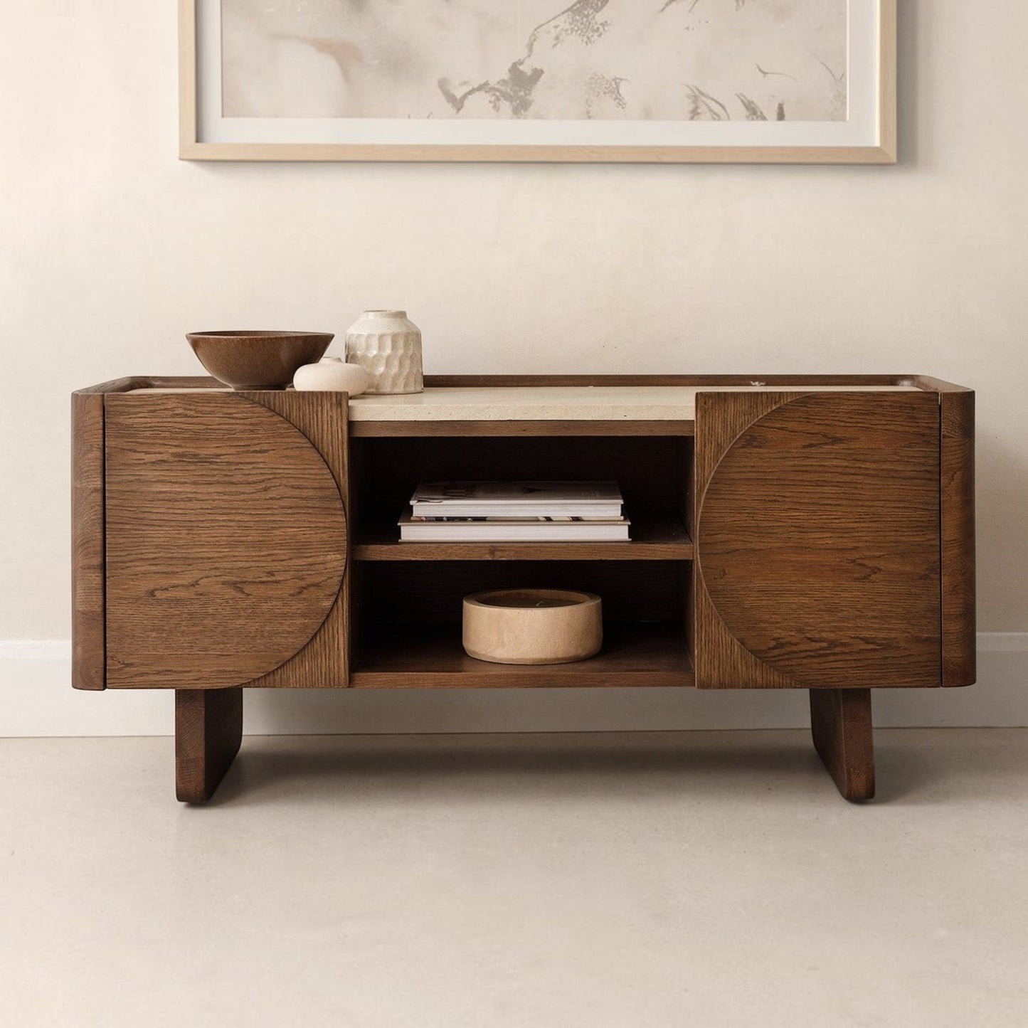 Pieces For Places Ida media unit in walnut finish with a travertine stone top and circular door detailing.