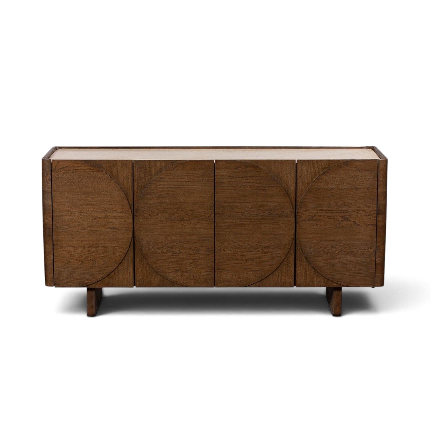 Pieces For Places Ida wide sideboard with walnut finish oak doors, circular detailing, and travertine stone top.