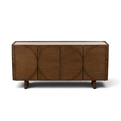 Pieces For Places Ida wide sideboard with walnut finish oak doors, circular detailing, and travertine stone top.