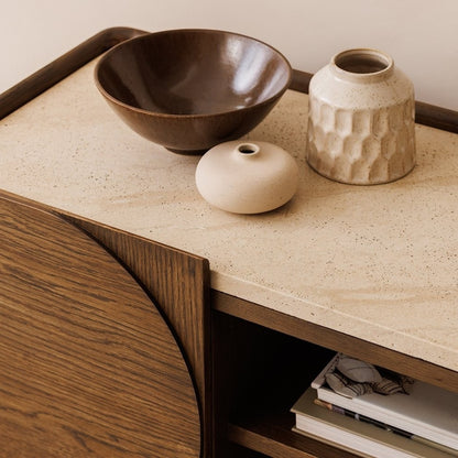 Pieces For Places Ida media unit with walnut finish oak frame and travertine effect concrete top, close-up view.