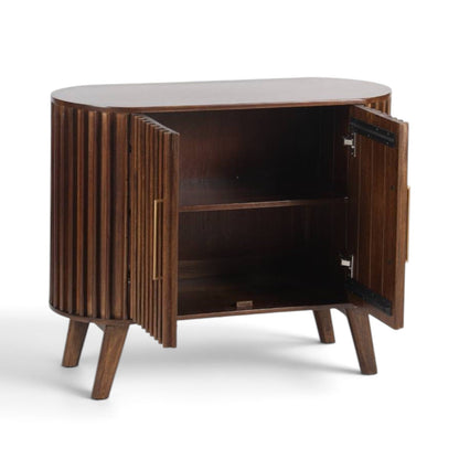Pieces For Places Mason dark mango wood sideboard with fluted slatted doors and curved ends, open cabinet view.