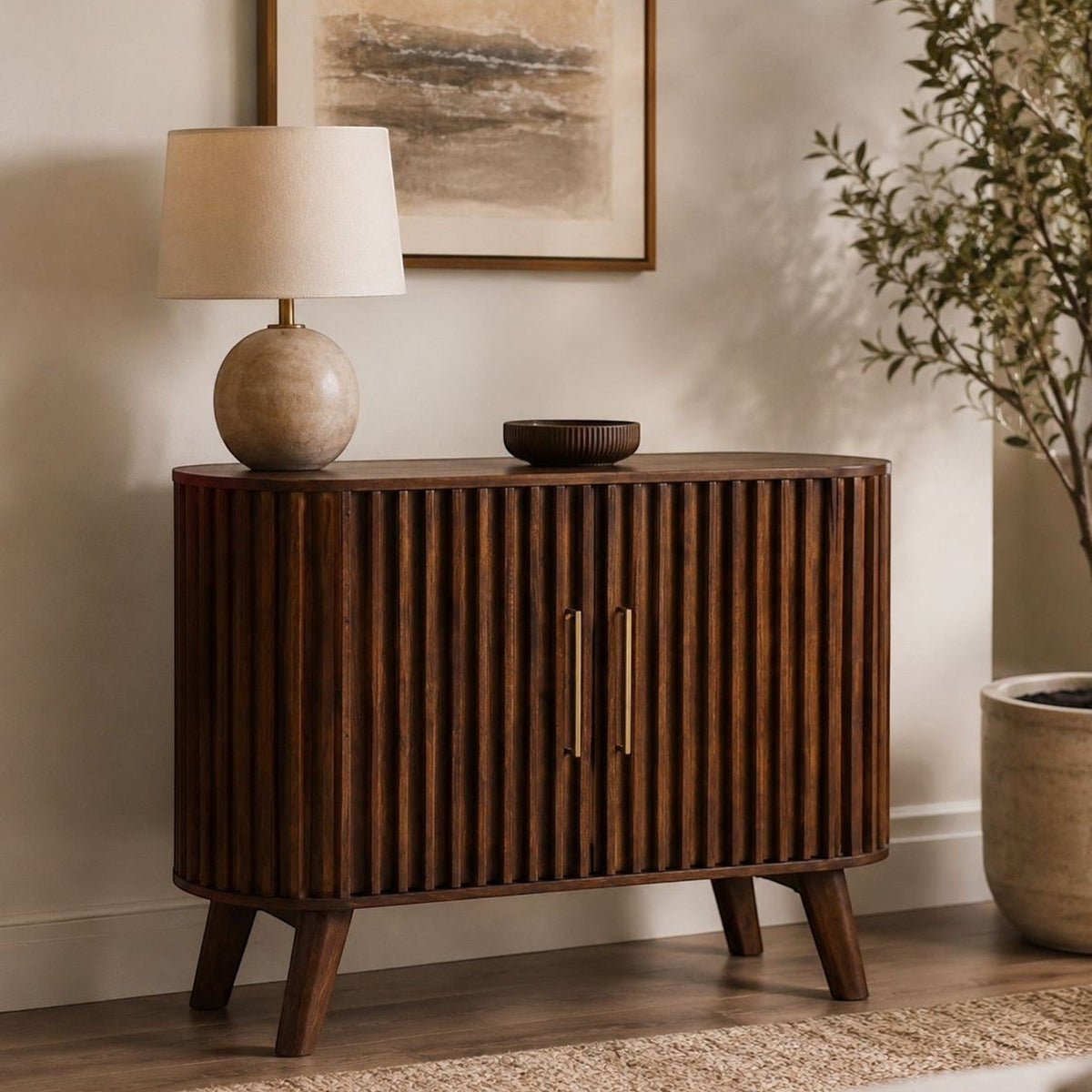 Pieces For Places Mason dark mango wood sideboard with fluted slatted doors and curved edges in a modern living room.