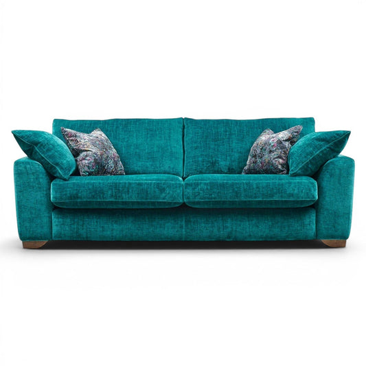 Pieces For Places Milo 3 Seater Sofa in teal fabric with plush seat and back cushions and decorative scatter cushions.