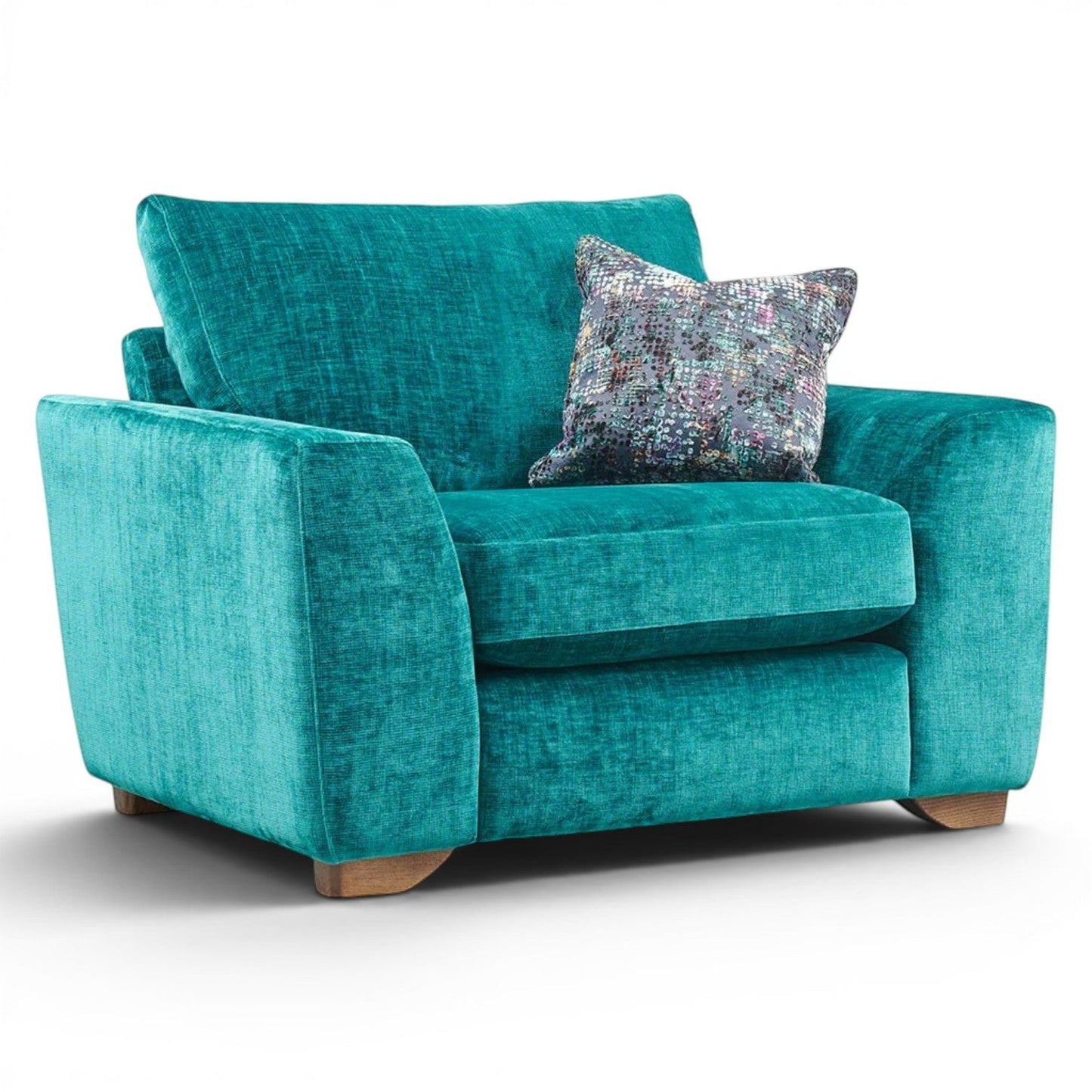 Pieces For Places Milo Armchair in teal velvet with a patterned scatter cushion and wooden feet. Modern design for plush comfort.