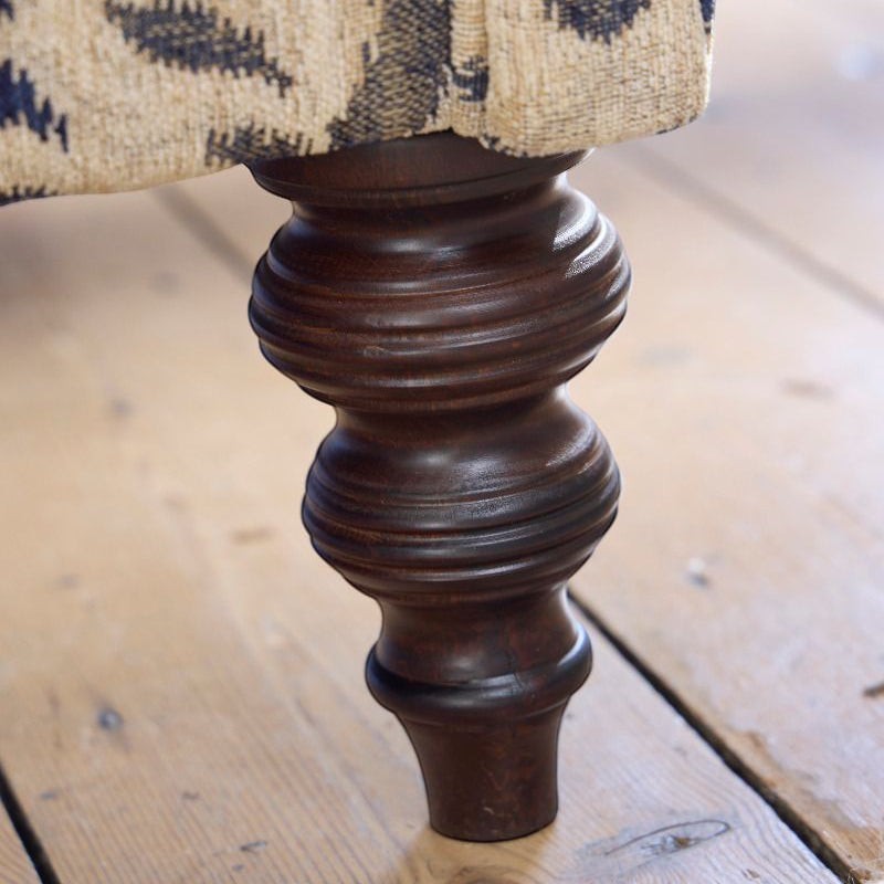 Pieces For Places Tallis Midi Sofa in Natural chenille fabric with dark wood carved legs.