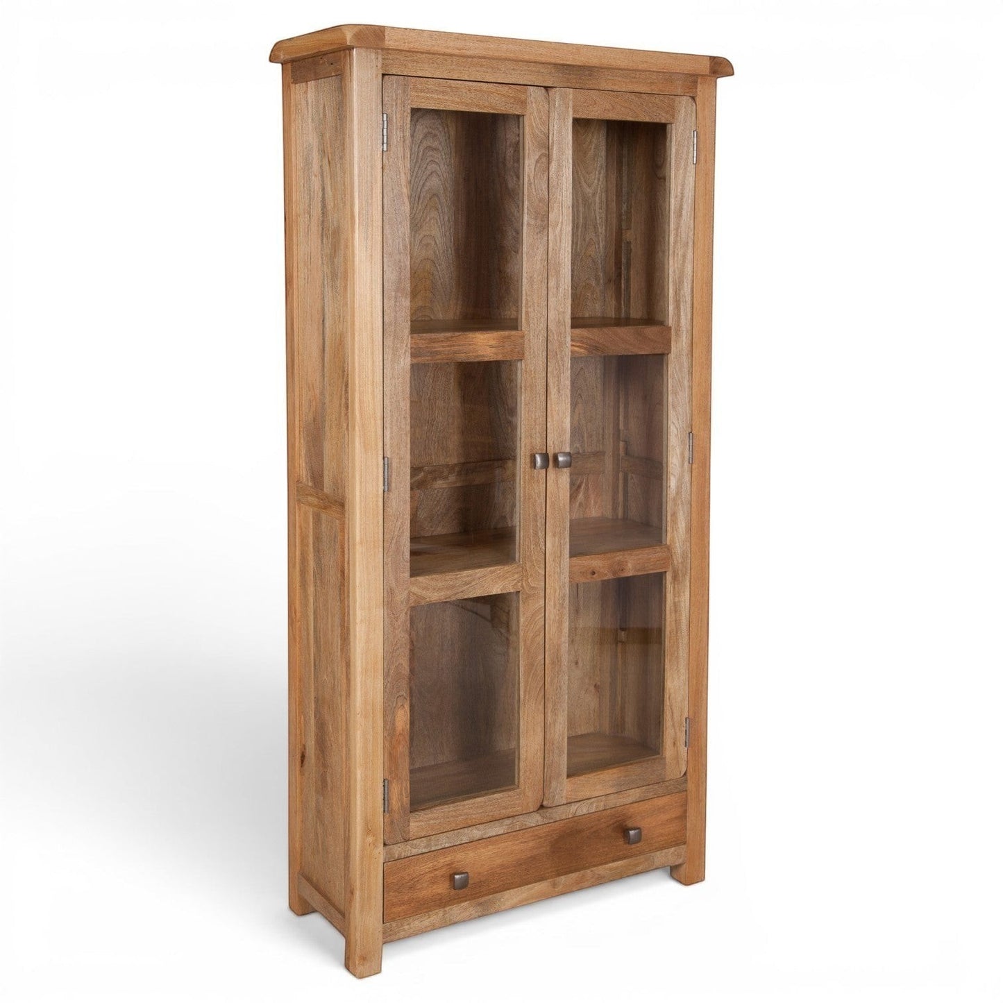 Pieces For Places Olda Glazed Display Cabinet in natural mango wood with glass doors, three shelves, and a bottom drawer.