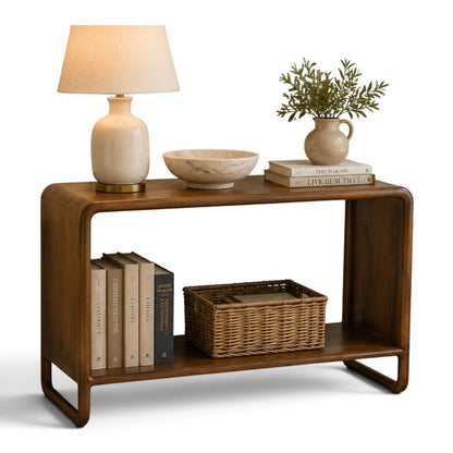 Pieces For Places Saturn curved console table in solid mango wood with a natural finish and open shelf design.