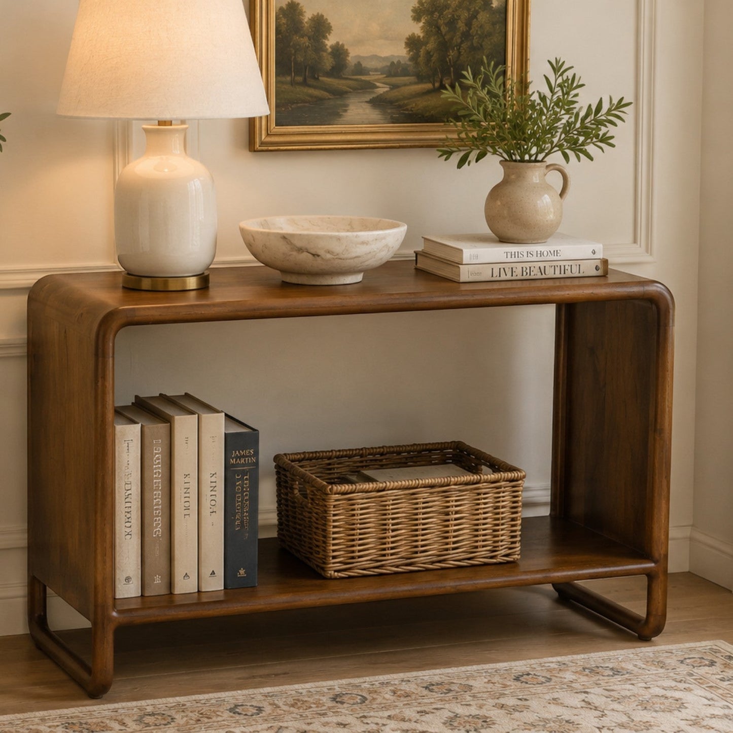 Pieces For Places Saturn curved console table in solid mango wood with a natural finish and open lower shelf.