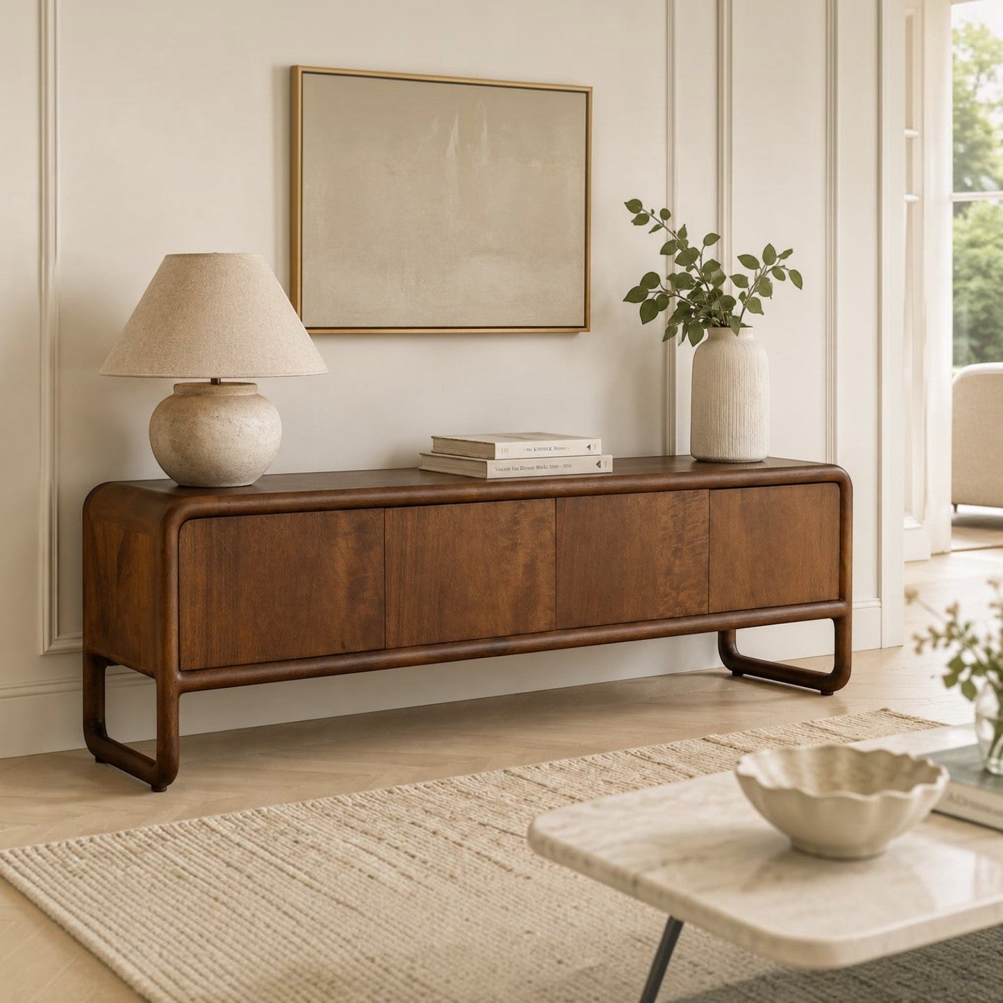 Pieces For Places Saturn mango wood 4 door media unit with curved edges and a warm natural wood grain finish.